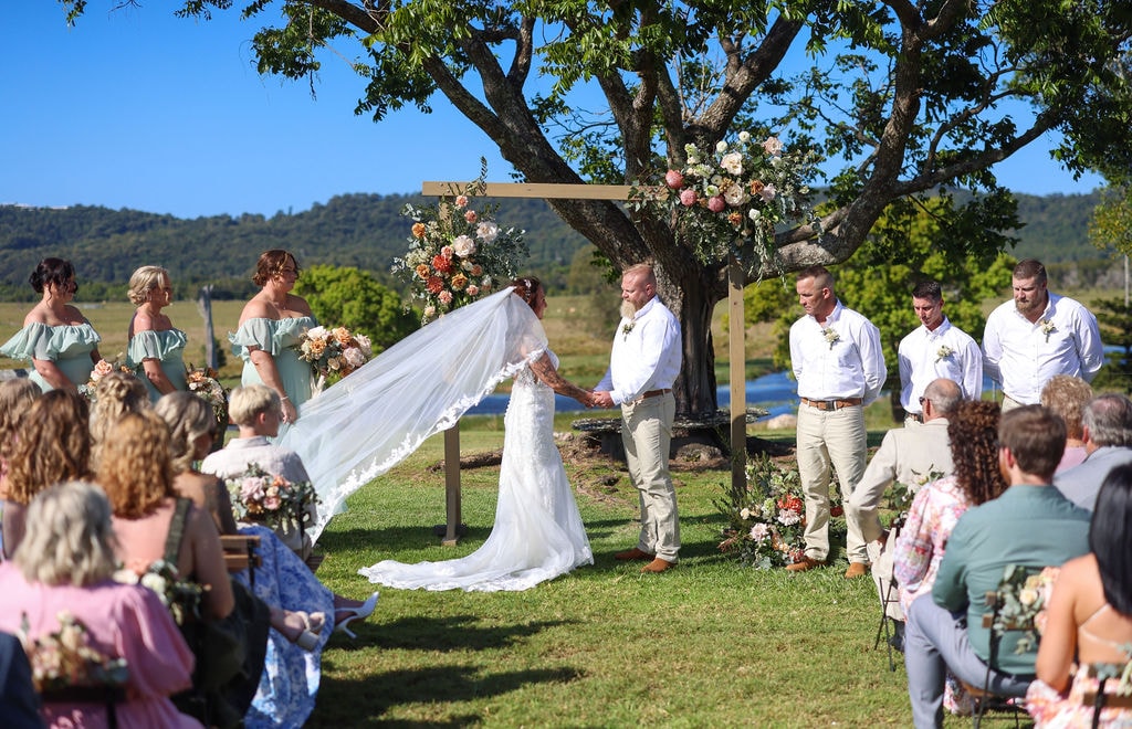 planning a destination wedding, initially promising misanthropic twist, ceremony, groom, bride, talk, paradise, room, amazing, writing, dialogue, advice, room