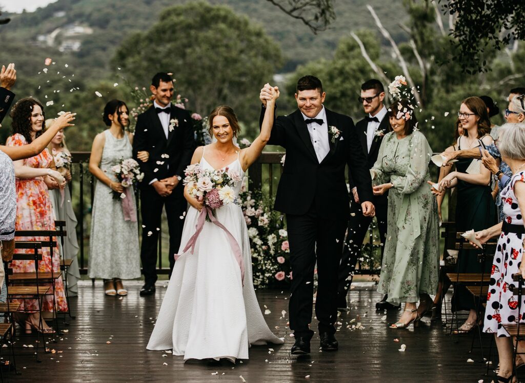 Restored 1856 heritage cottage exterior at Yandina Station with verandah and garden surrounds for wedding guest accommodation
