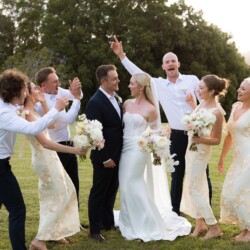 Wedding party celebrating outdoors at a Sunshine Coast hinterland wedding venue